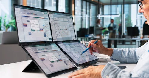Law firm professional reviewing client matter updates on a digital dashboard.